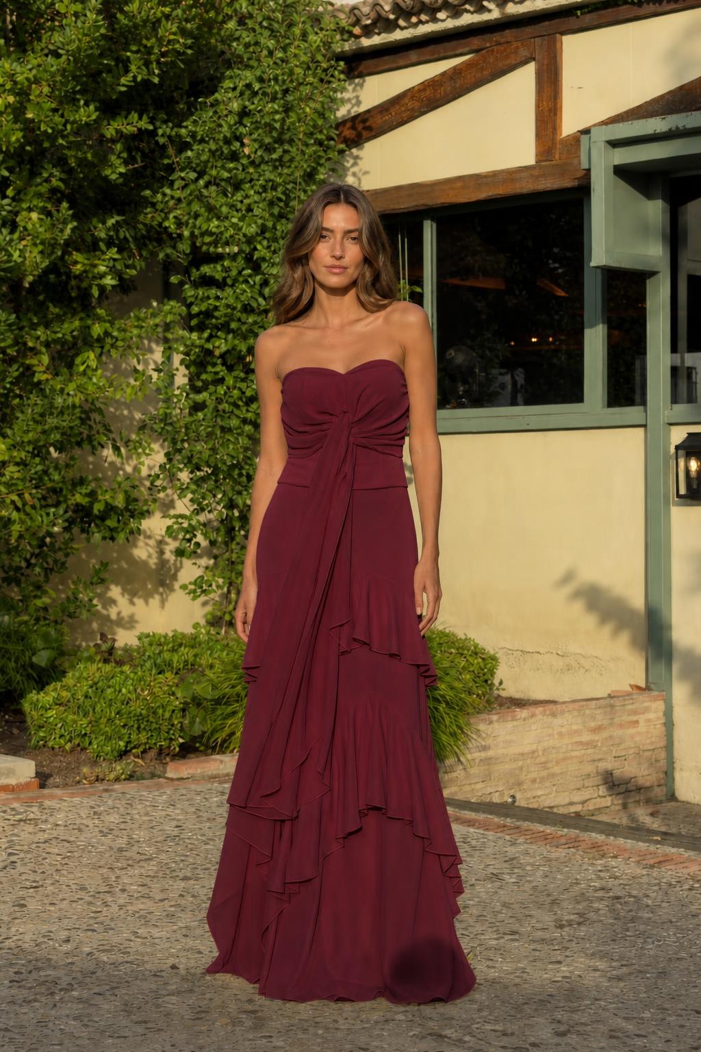 Front view of burgundy strapless evening dress
