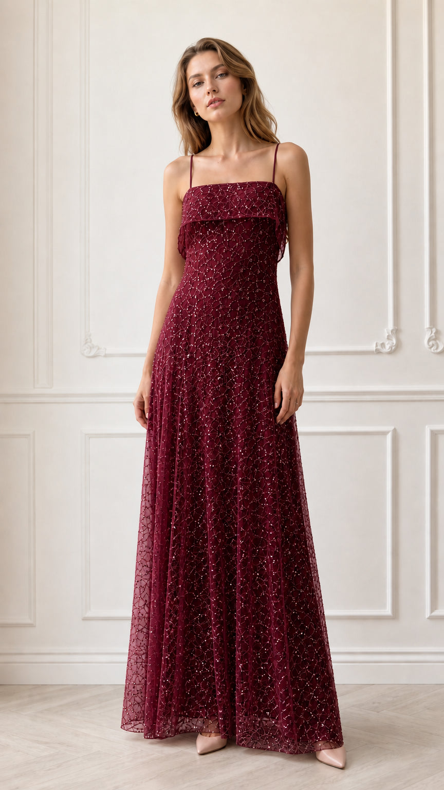 Model wearing burgundy wine red sequin embroidered evening gown