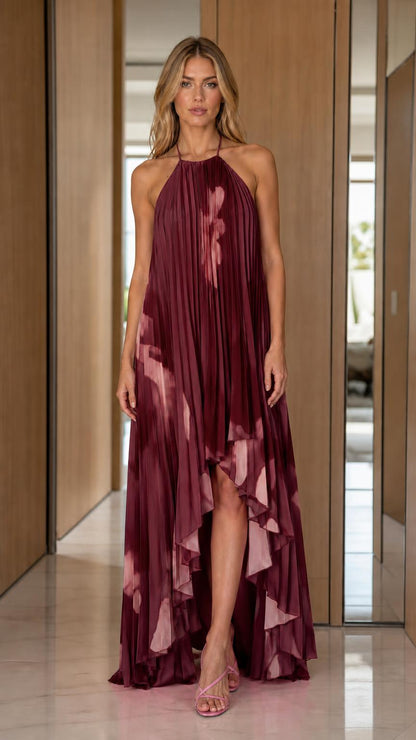 Front view of woman wearing burgundy pleated halter maxi dress