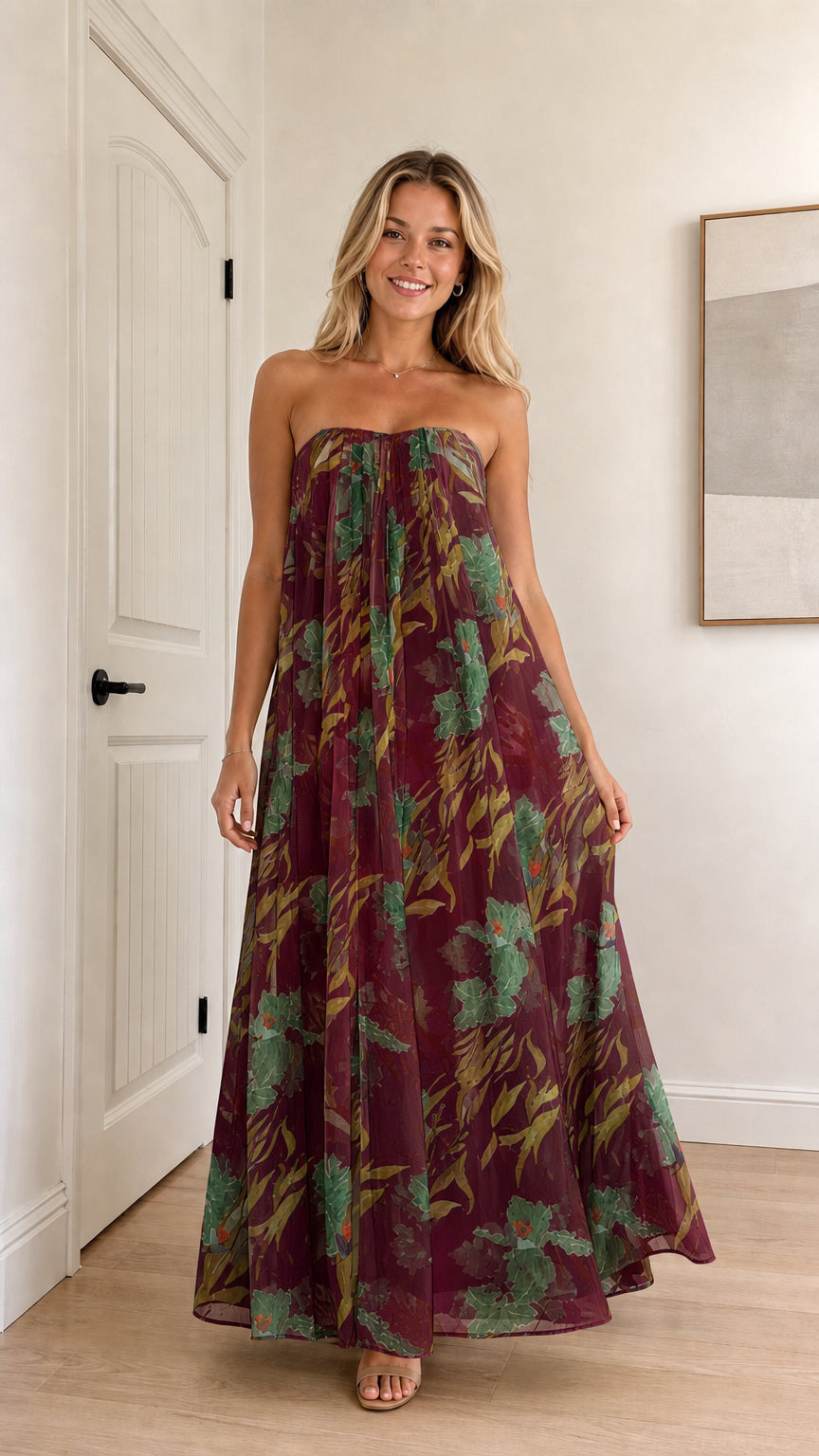 Model wearing burgundy floral strapless maxi dress
