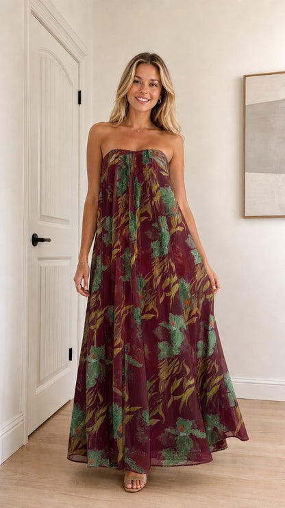 Model wearing burgundy floral strapless maxi dress