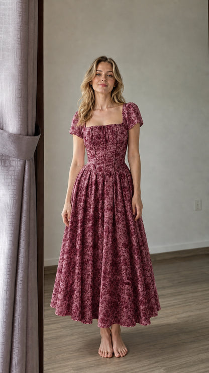 Woman wearing burgundy floral midi dress