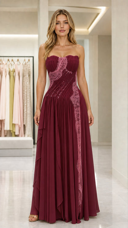 Front view of burgundy strapless pleated evening gown