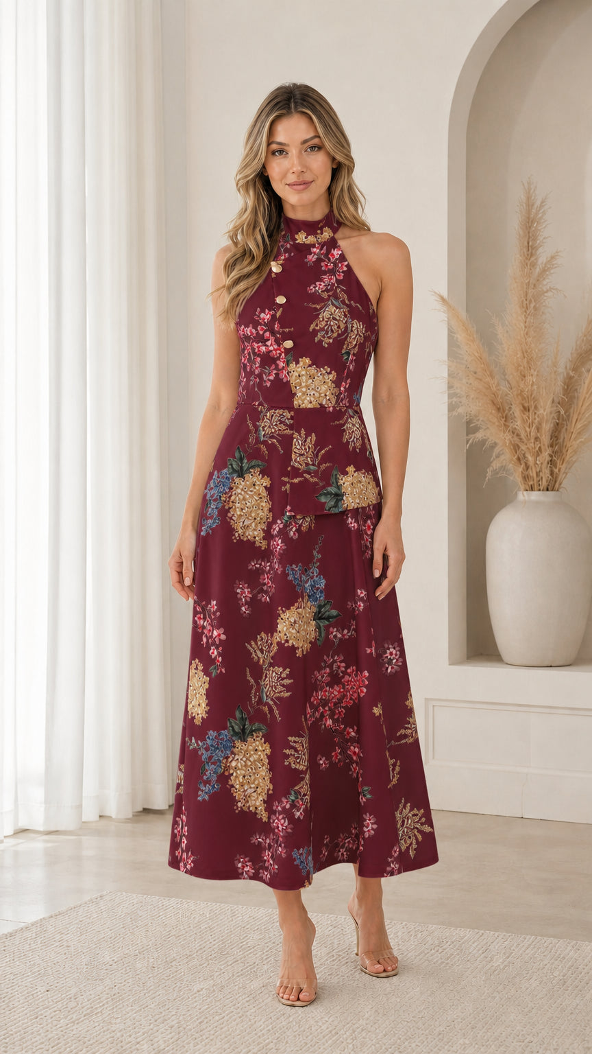 Model wearing burgundy floral print halter neck midi dress