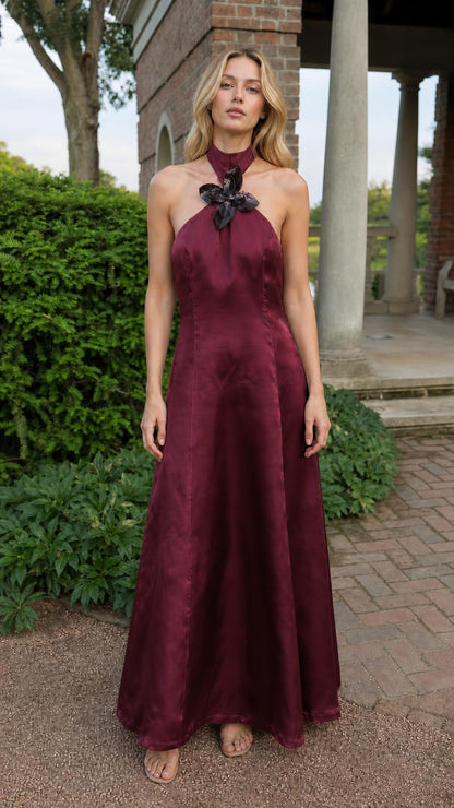 Full front view of model in burgundy satin halter maxi dress