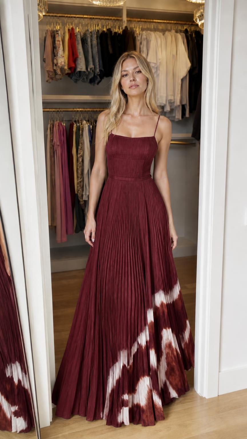 Model wearing burgundy pleated maxi dress