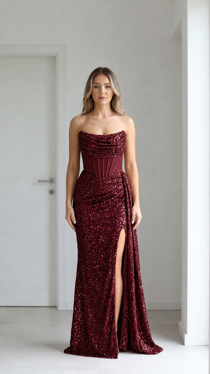 Front view of burgundy sequin evening gown with high slit