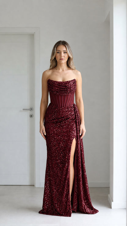 Front view of burgundy sequin evening gown with high slit