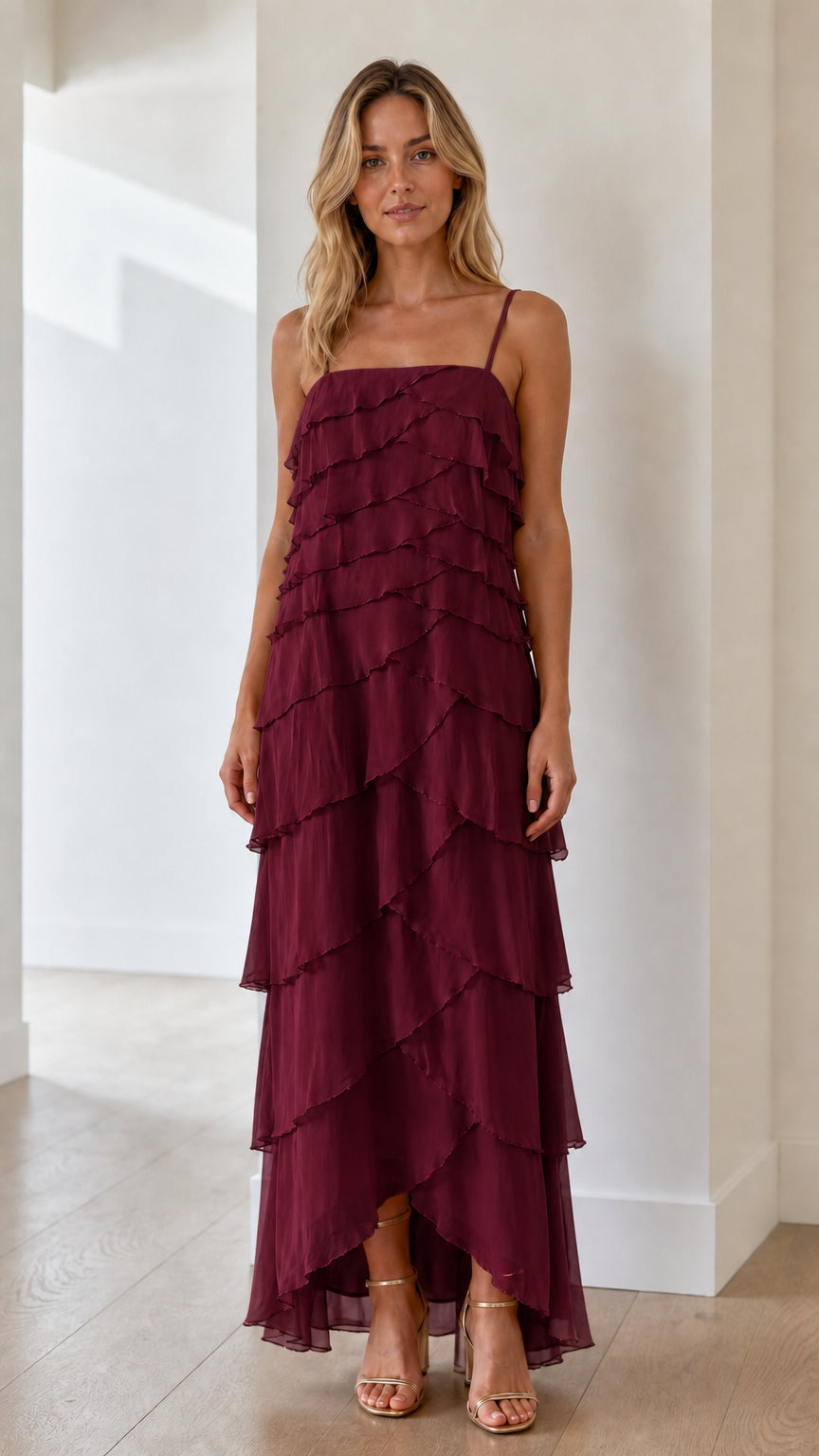 Model wearing burgundy tiered ruffle maxi dress