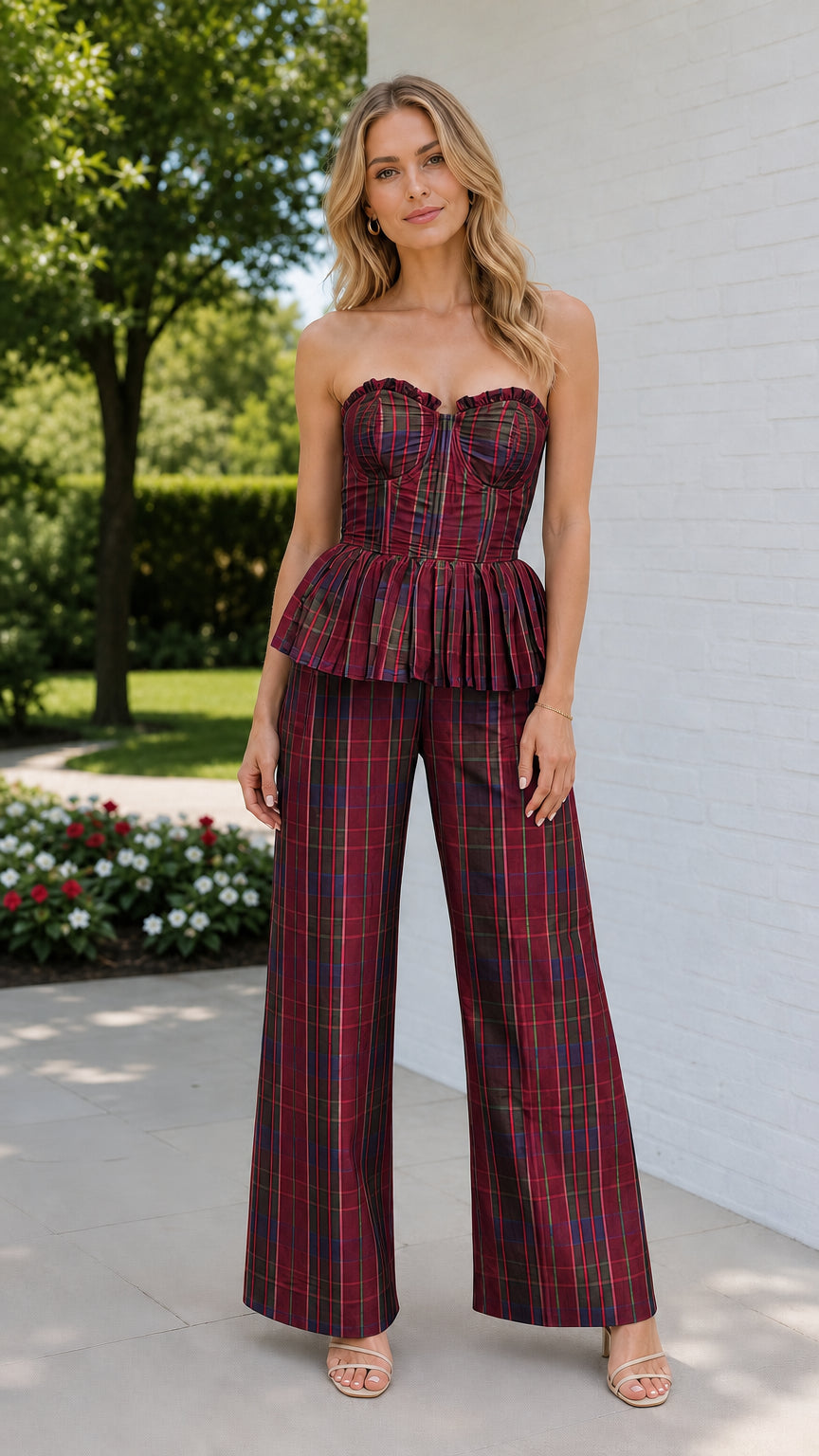 Model wearing burgundy plaid strapless bustier and wide leg pants set