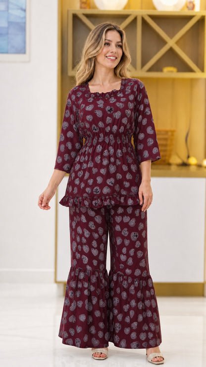 Burgundy wine floral print 2-piece top and flared trousers set on model