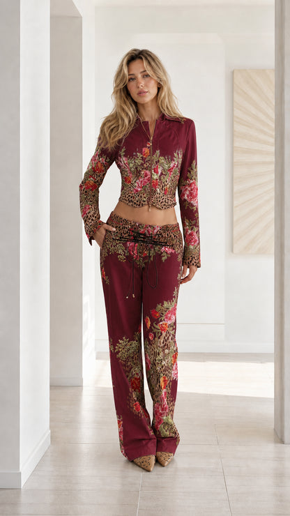 Woman wearing Burgundy floral leopard print cropped jacket and wide leg pants set