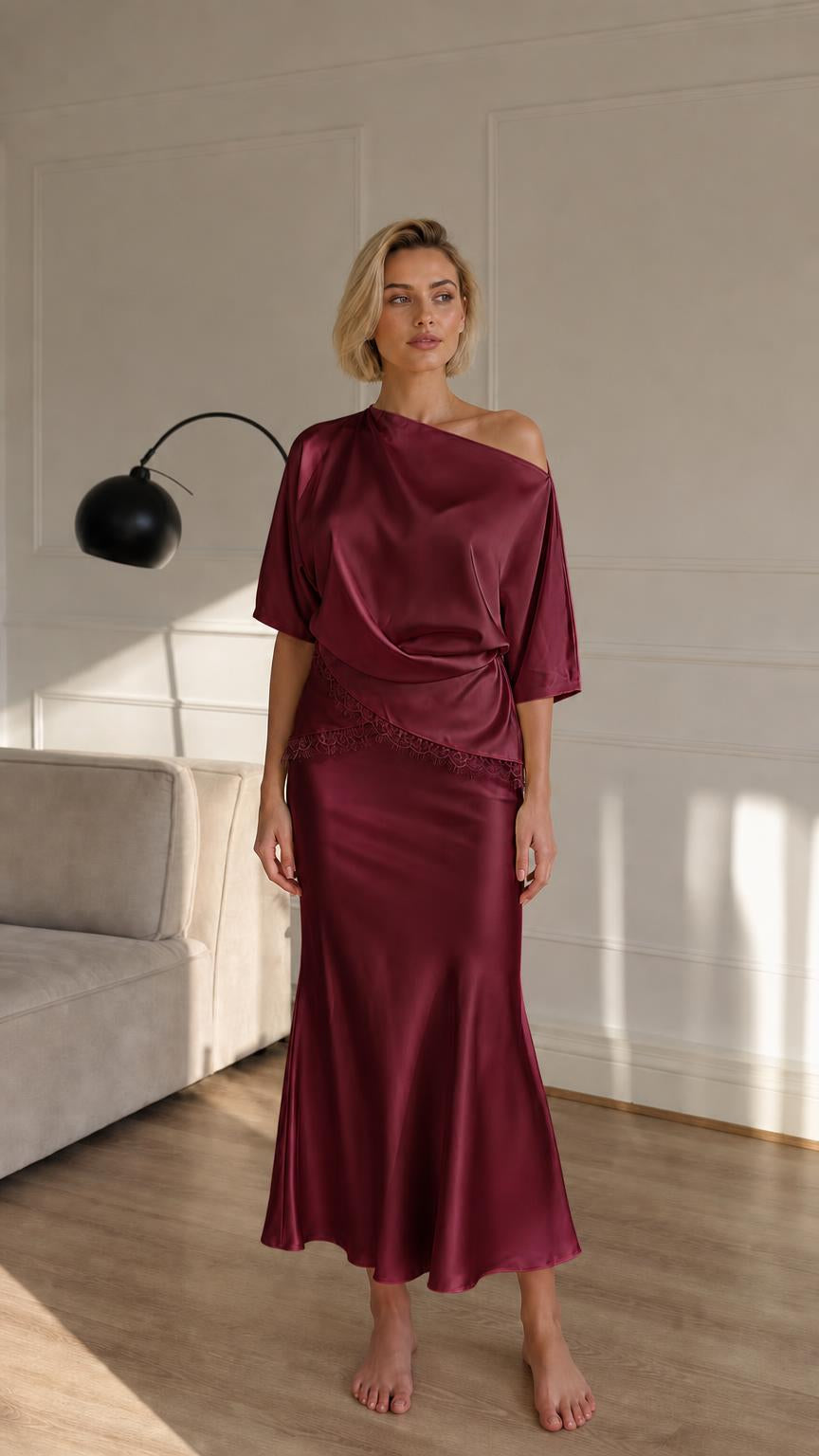 Woman wearing burgundy satin two-piece set
