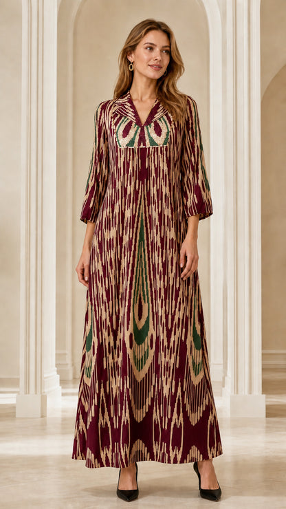 Front full-length view of woman wearing Burgundy Ikat Print Embellished Maxi Dress