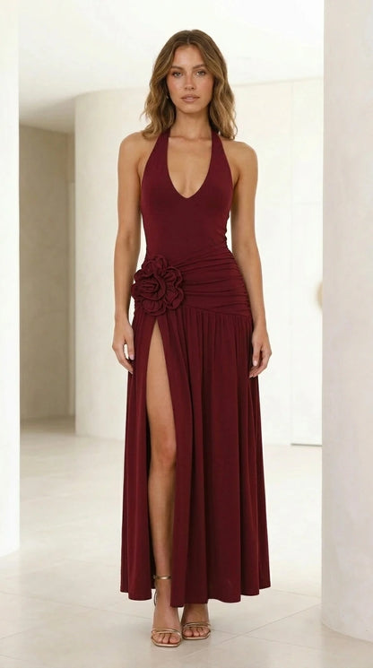 Front view of model wearing burgundy halter neck maxi dress