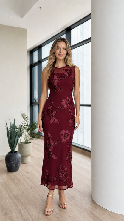Model wearing burgundy floral applique mesh midi dress