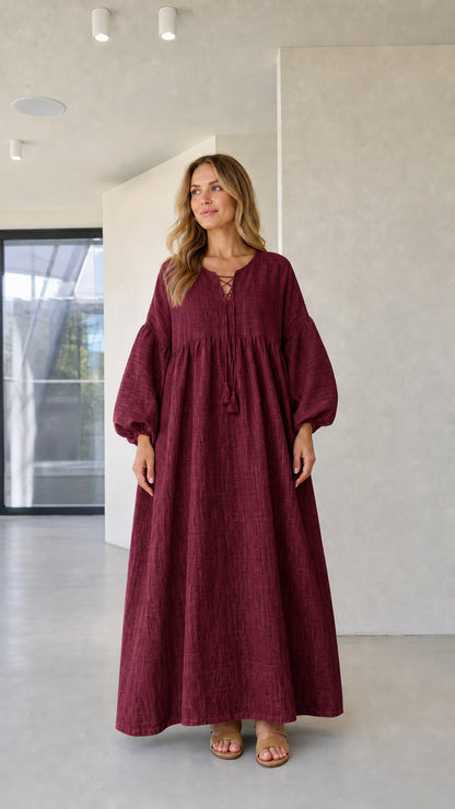 Model wearing burgundy wine red lace-up empire waist maxi dress