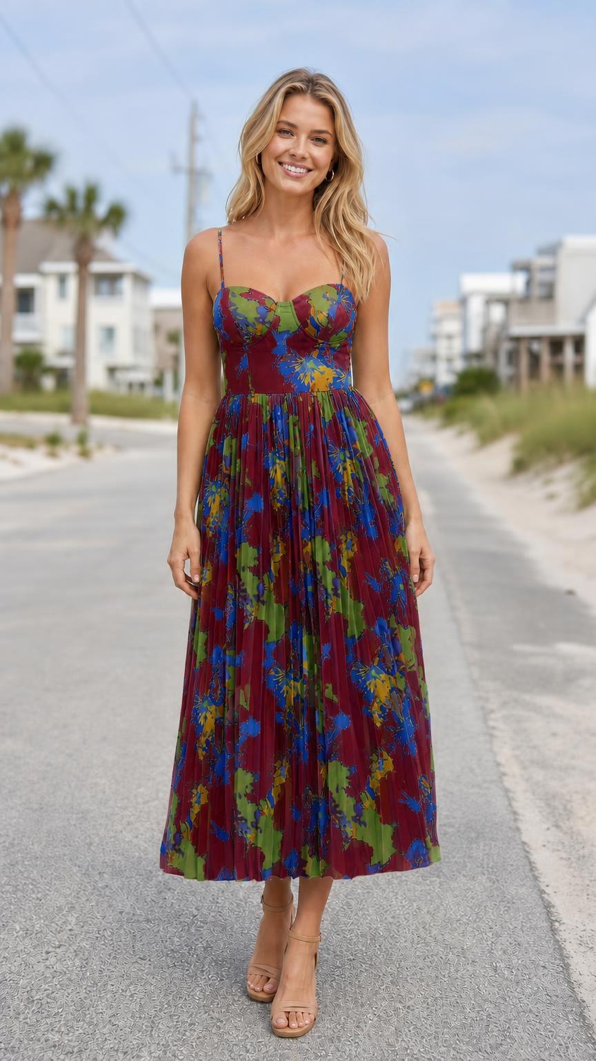 Model wearing burgundy floral print bustier pleated midi dress
