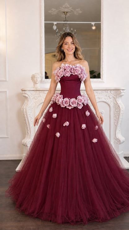 Model wearing the burgundy color variant with floral embellishments