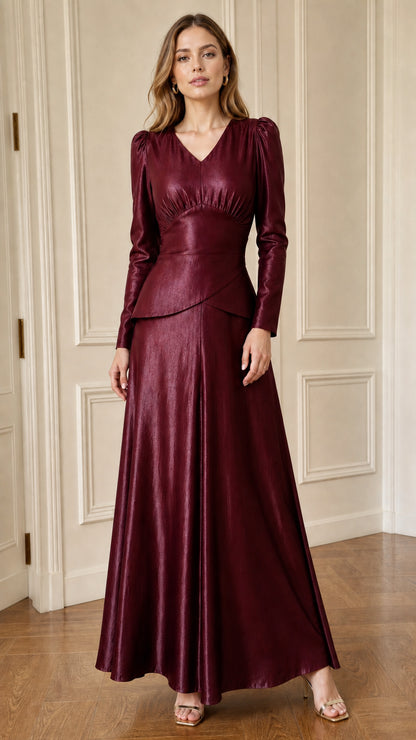 Woman posing in burgundy faux leather long sleeve maxi dress