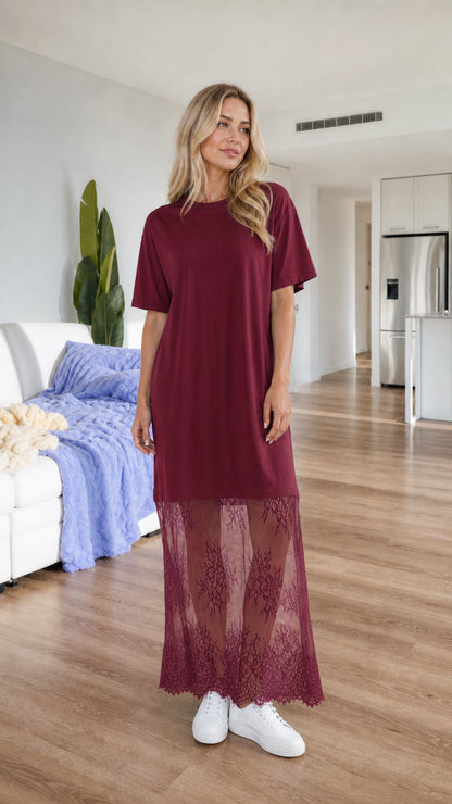 Front view of woman wearing burgundy wine short sleeve t-shirt dress with lace hem
