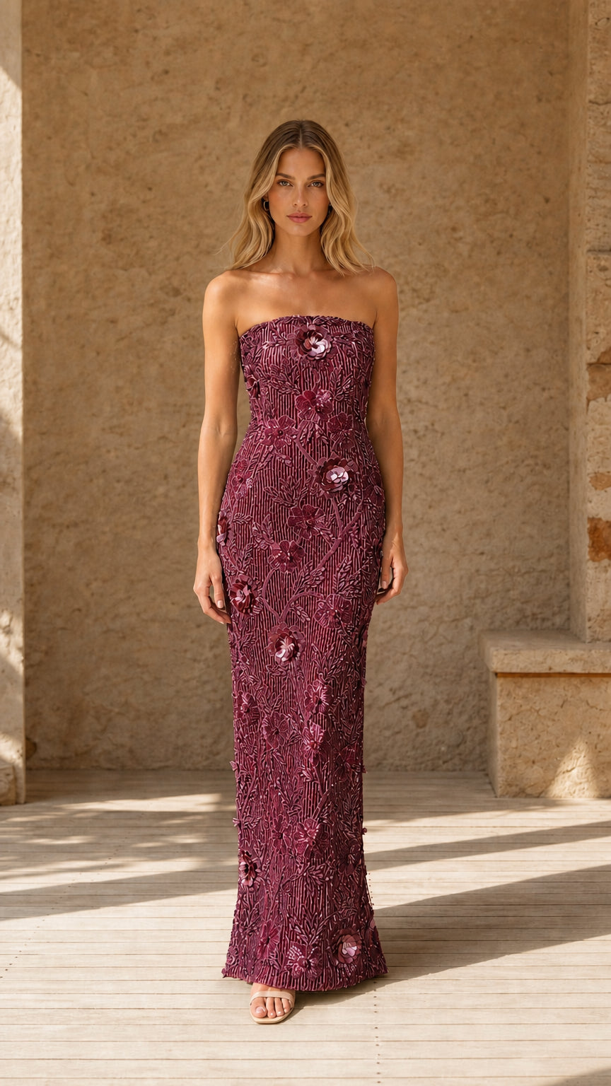 Front view of model wearing Burgundy wine sequin strapless column gown