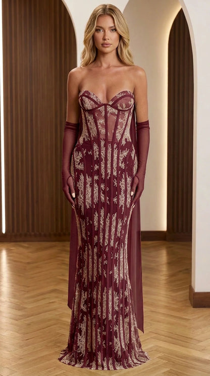 Front view of burgundy strapless corset evening gown with gloves