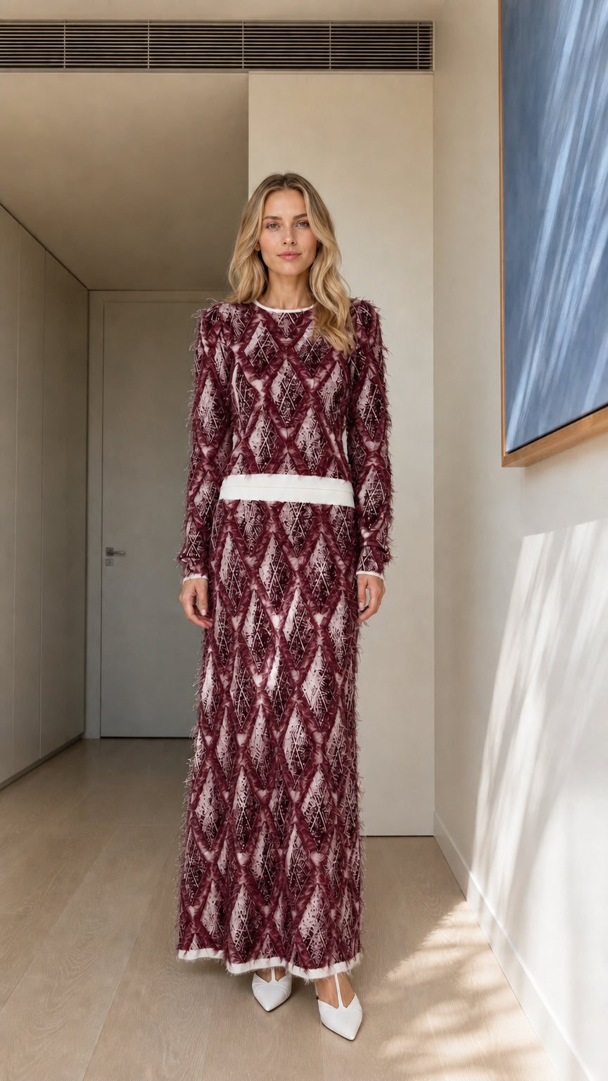 Model wearing burgundy textured knit maxi dress