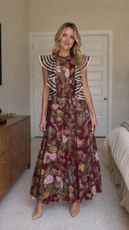 Woman wearing burgundy floral ruffle maxi dress