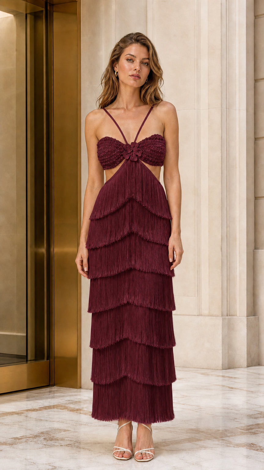 Front view of model wearing burgundy wine cutout tiered fringe maxi dress