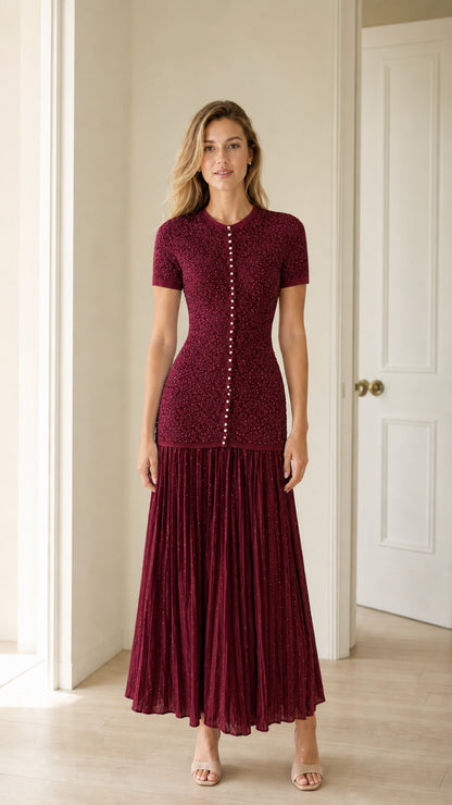 Front view of burgundy pearl button knit bodice pleated midi dress
