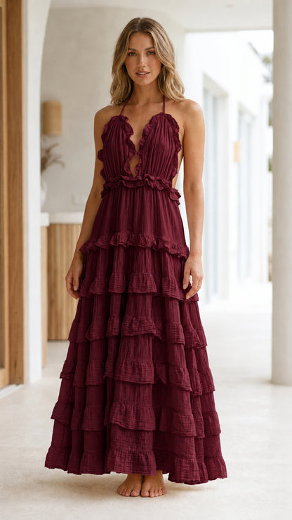 Model wearing Burgundy Boho Ruffle Halter Backless Tiered Maxi Dress