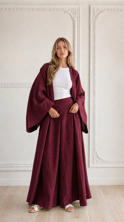 Full-length view of woman wearing burgundy wine-colored 2-piece kimono pant set