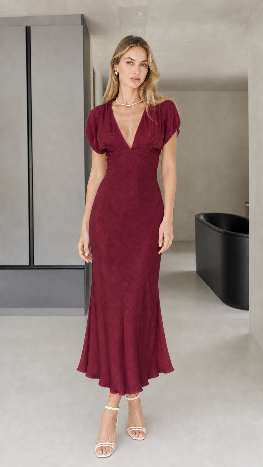 Front view of model wearing burgundy midi dress