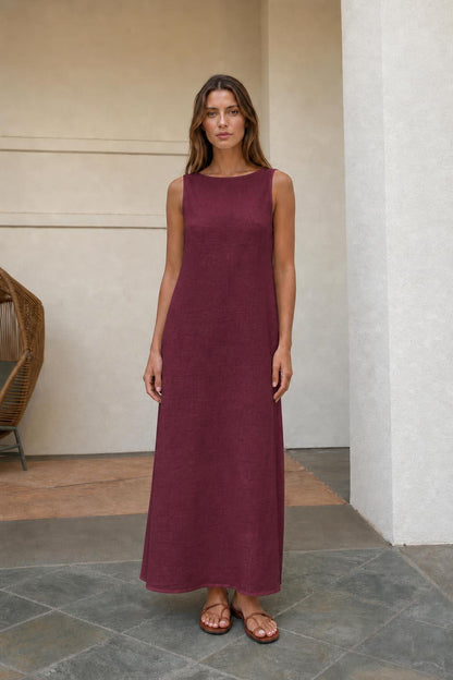Woman wearing burgundy sleeveless maxi dress