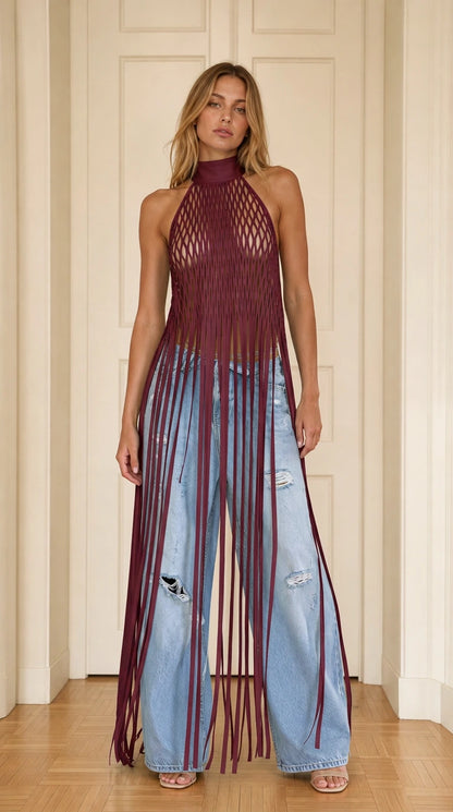 Model wearing burgundy halter neck cutout fringe long top