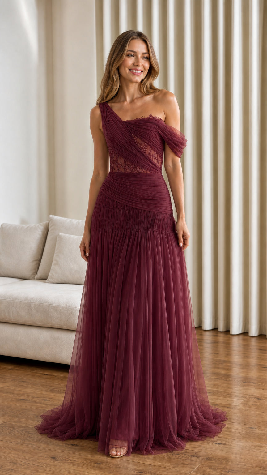 Front view of burgundy one-shoulder pleated tulle evening gown