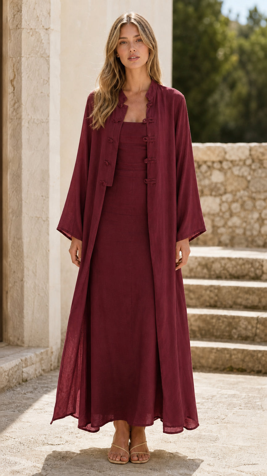 Front view of woman wearing burgundy two-piece jacket and maxi dress set