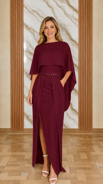 Model wearing burgundy cape overlay jumpsuit