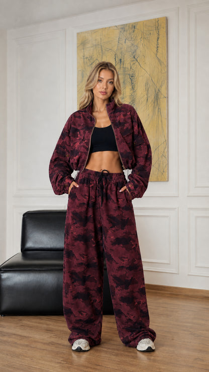 Model wearing burgundy camouflage cropped jacket and wide-leg pants set