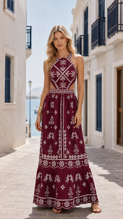 Model wearing burgundy embroidered cutout halter maxi dress