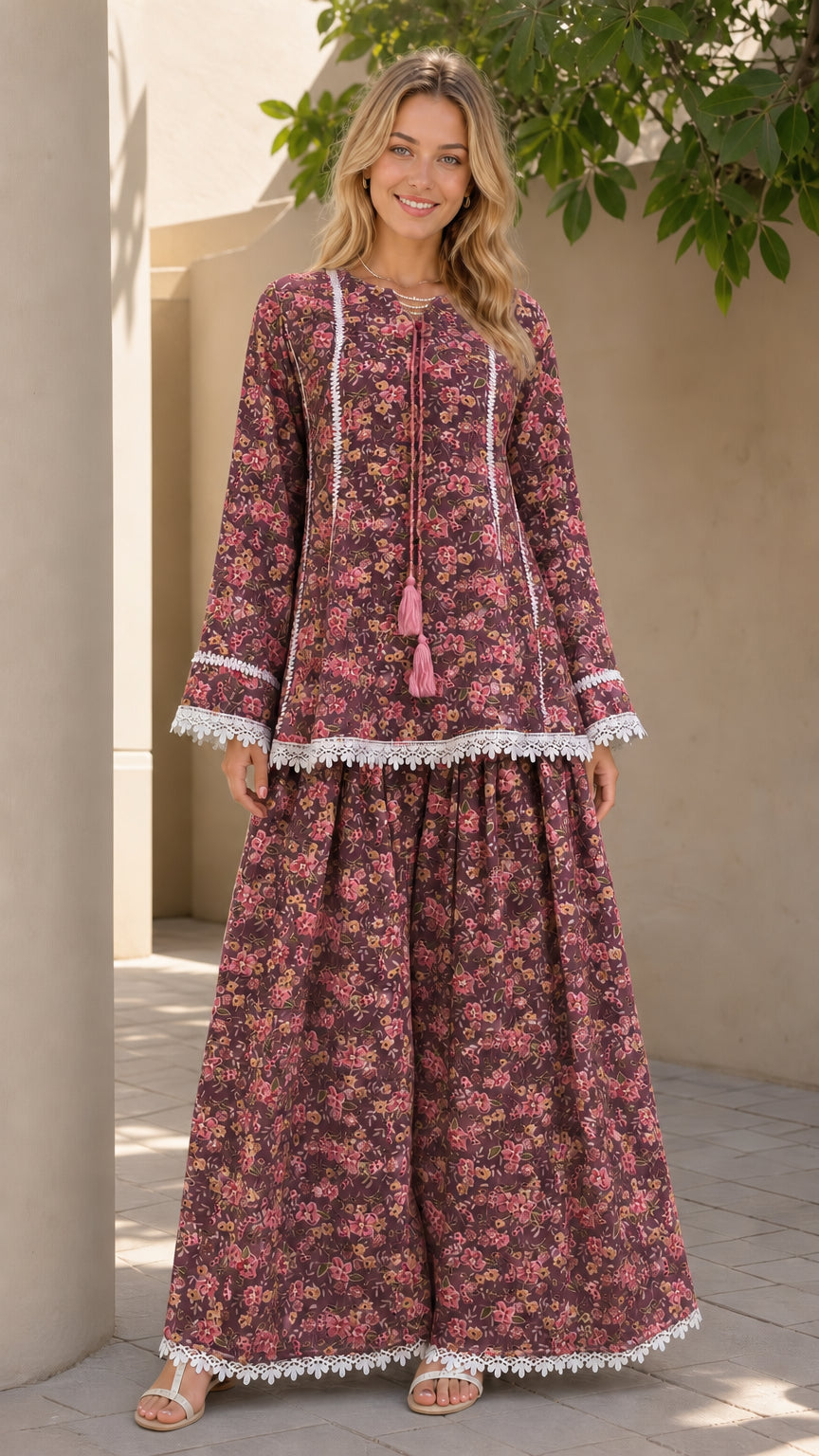 Model wearing burgundy floral matching tunic and pants set