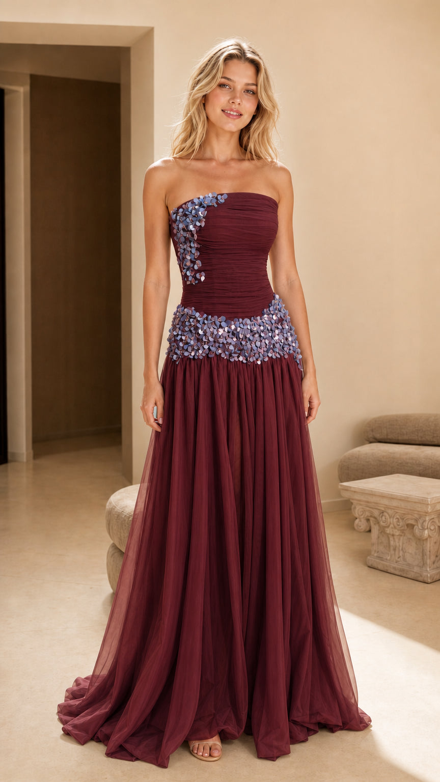 Front view of burgundy strapless floral applique gown