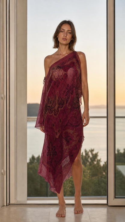 Model wearing burgundy paisley one-shoulder maxi dress
