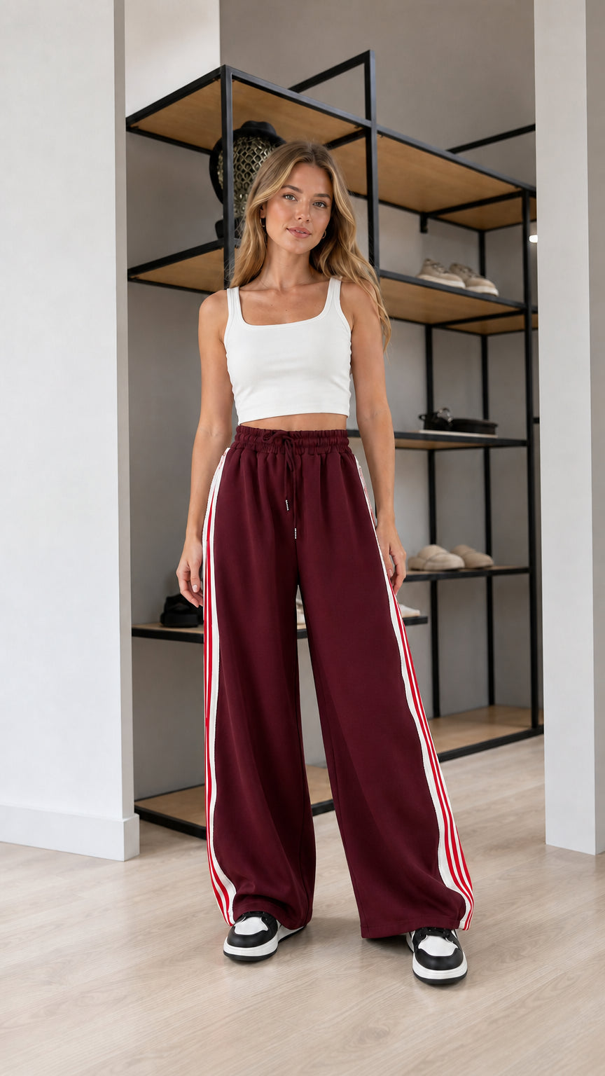 Front view of model wearing Burgundy wide leg striped sweatpants