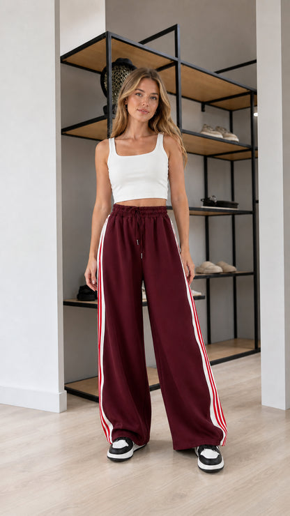 Front view of model wearing Burgundy wide leg striped sweatpants