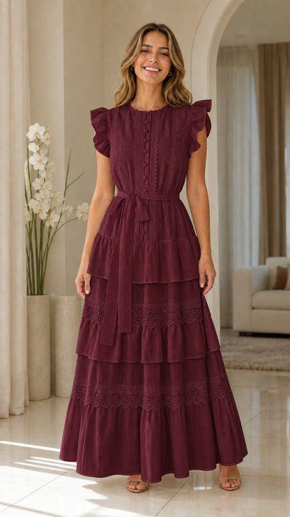 Woman wearing burgundy ruffle sleeve tiered maxi dress