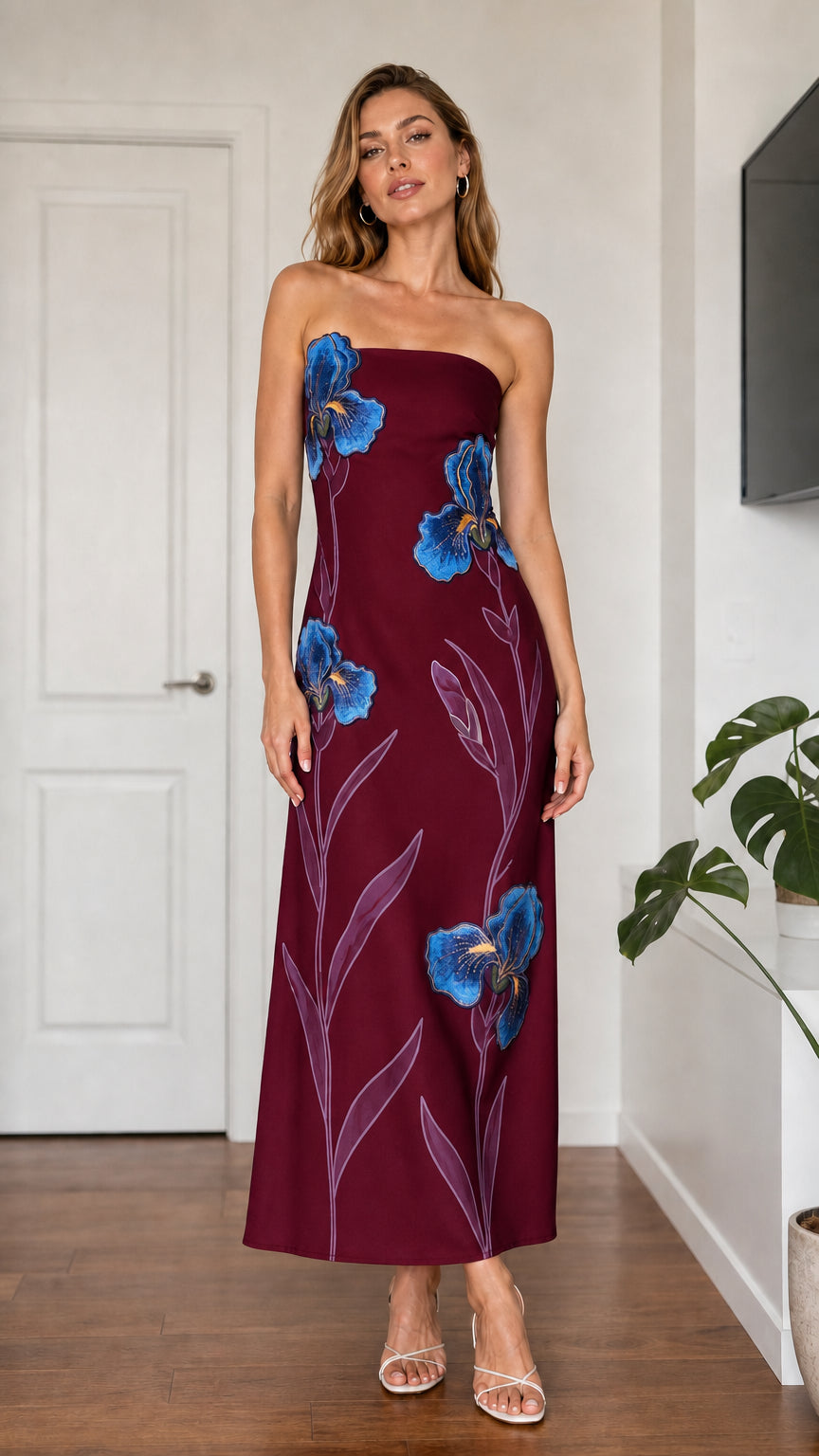 Model wearing burgundy strapless floral embroidered maxi dress