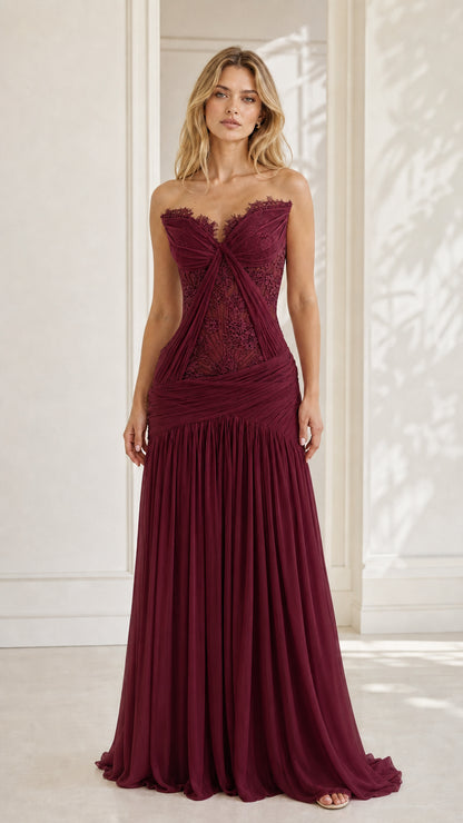 Model wearing burgundy strapless lace evening dress