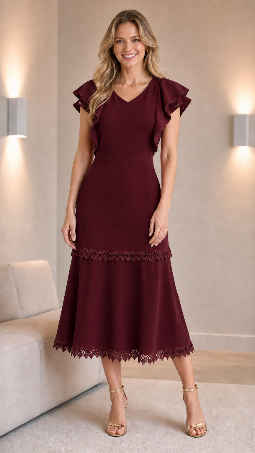 Woman wearing burgundy V-neck ruffle sleeve midi dress